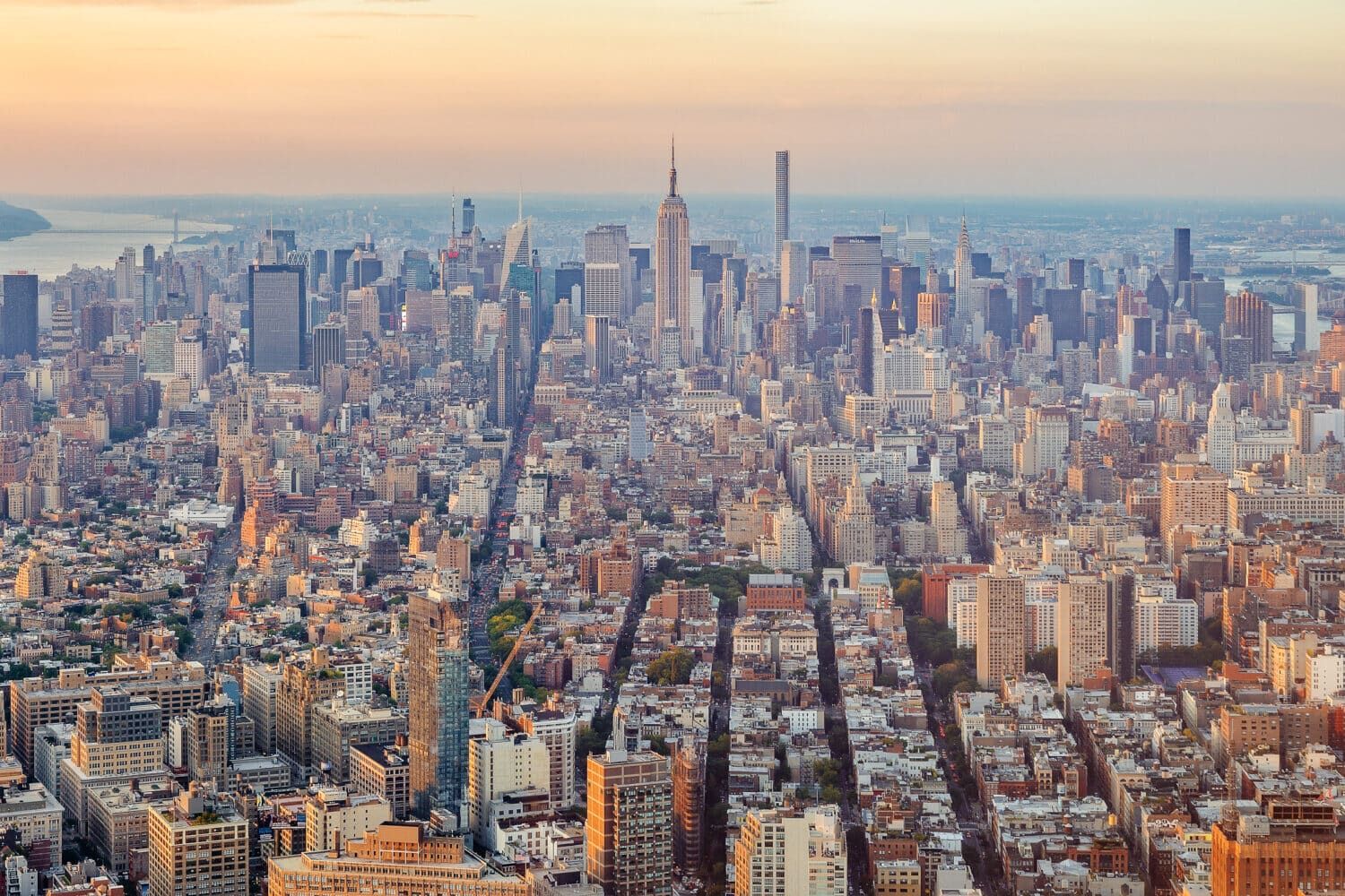 Aerial view of a city skyline at sunset